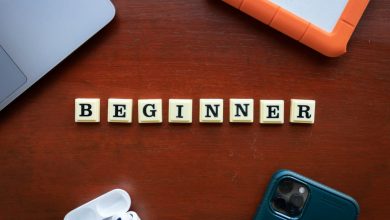 a wooden block spelling out the word begin