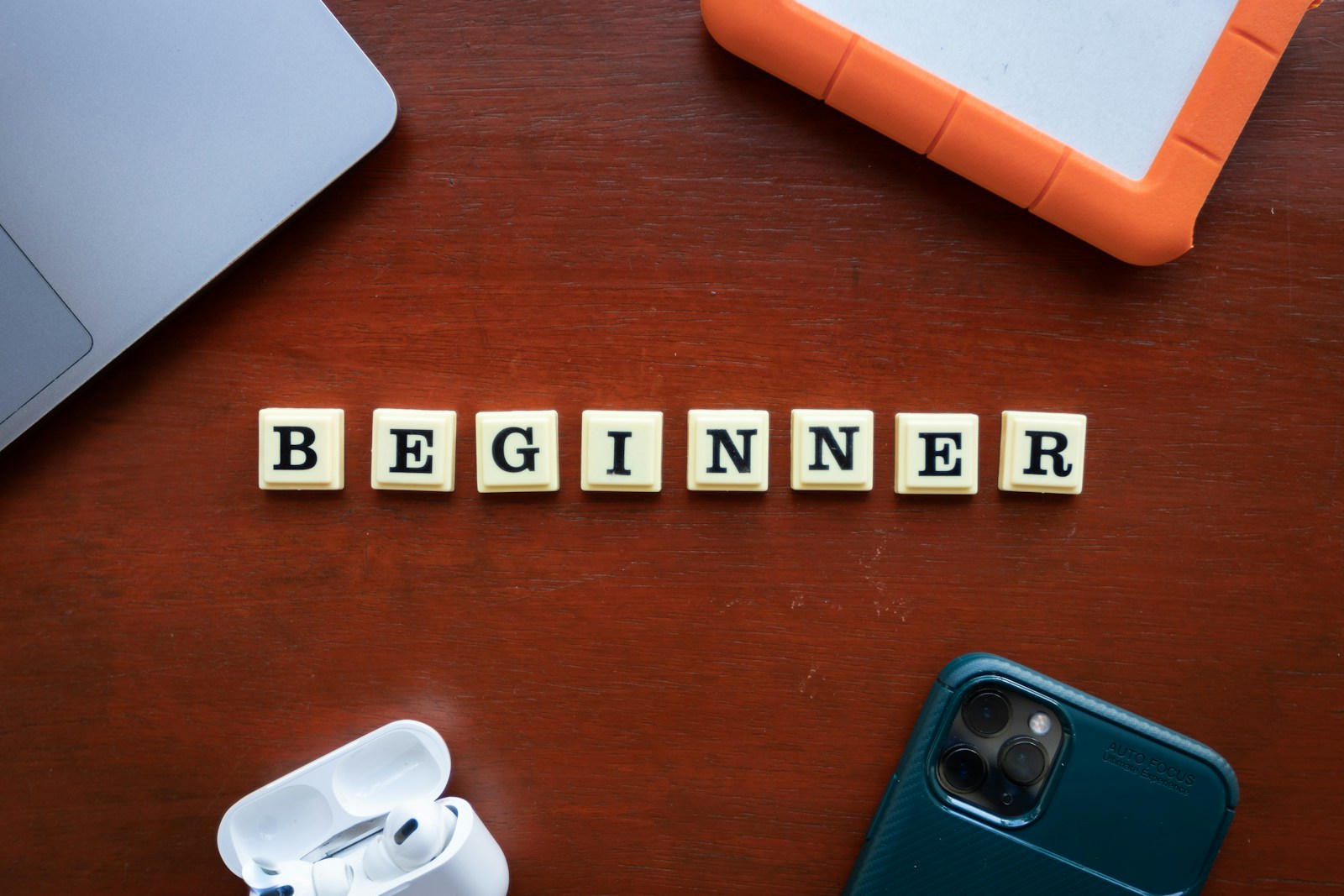 a wooden block spelling out the word begin