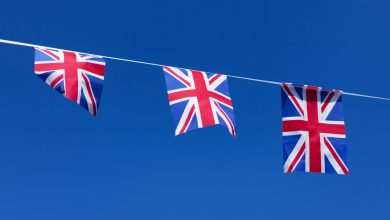 three british flags hanging on a clothes line